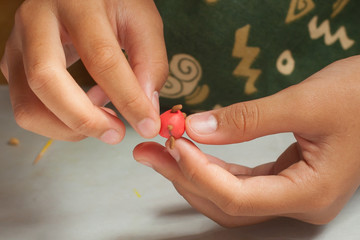 Child hands with plasticine in home at Thailand.