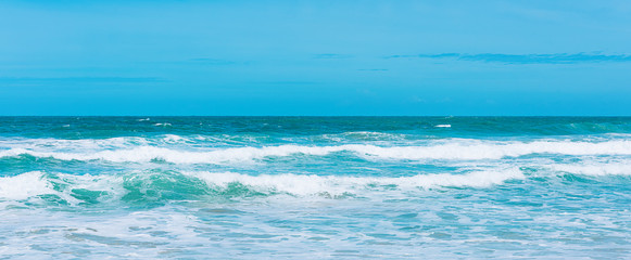 Sea view from tropical beach with sunny sky
