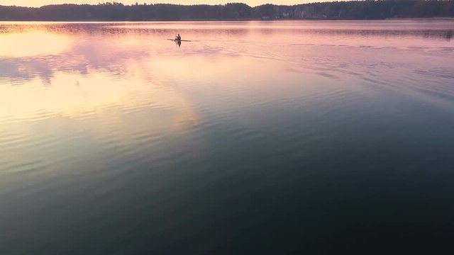 Paddling a kayak at dusk