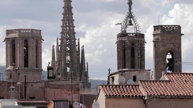 the rooftops of barcelona shot from a terrace in the centre of the city.