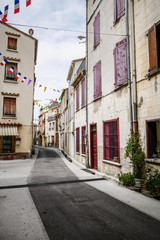 Narrow street in small village of South of France with nobody
