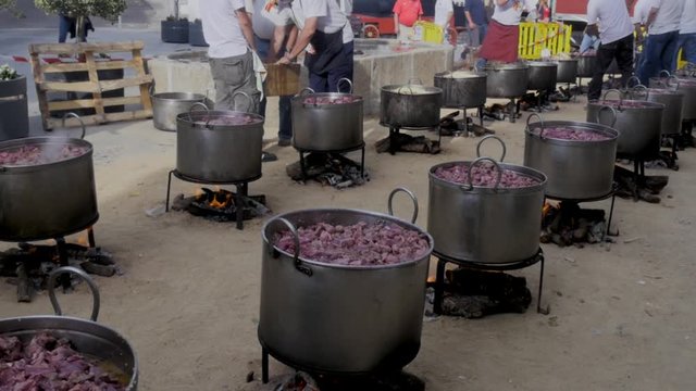 Popular food cauldrons while cooking bull meat
