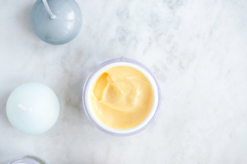 Organic skincare cosmetics on white marble background. Creams, balms, masks, oils, serums. Top view.  Beauty blogger concept