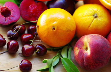 Naklejka na ściany i meble plums, peaches,cherry and citric fruits