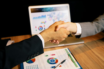 business person shaking hands.