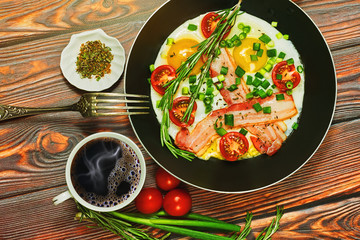 Breakfast with fried eggs and black coffee