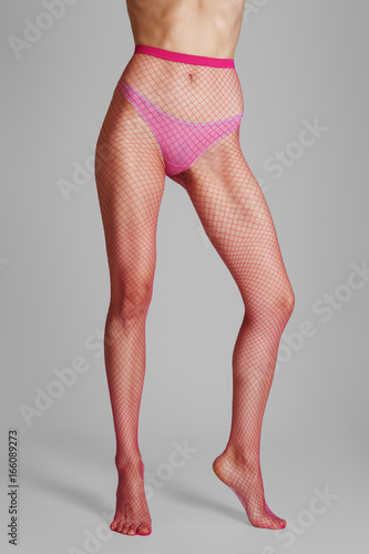 Download "Long muscular female legs in sexy pink fishnet tightsLong ...