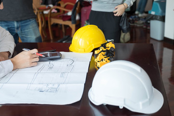 Construction engineering. Close up of engineers hands working on table