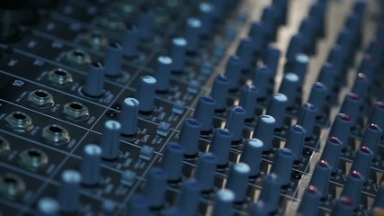 Professional audio console in a concert, sound mixer console during a concert, audio Mixer, control engineer, selective focus, audio mixer, shallow depth of field