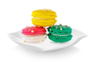 macaroons in ceramic plate (beautiful shape) on white background