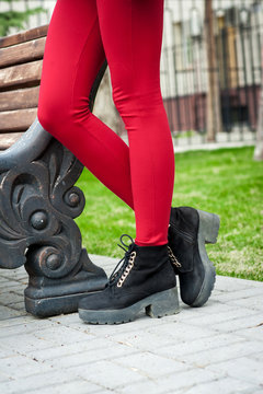 Woman Legs In Red Trousers.