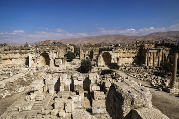 Entrance of ruins of Jupiter temple and great court of Heliopolis with mountains in the background in Baalbek, Bekaa valley Lebanon