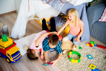 Kids in a wigwam © Nichizhenova Elena