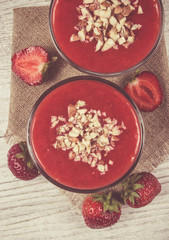 Strawberry smoothie with fresh fruit .