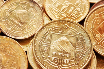 Close up picture of Nepalese rupee coins, shallow depth of field.