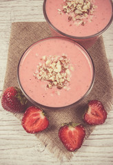 Strawberry smoothie with fresh fruit .