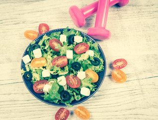 Greek salad with fresh vegetables, feta cheese and black olives.