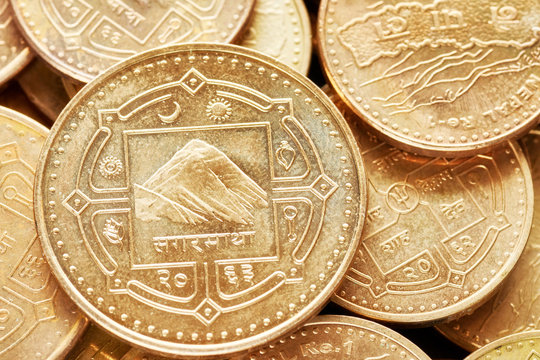 Close up picture of Nepalese rupee coins, shallow depth of field.