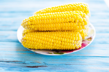A yellow corn is boiled