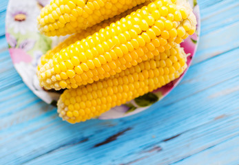 A yellow corn is boiled