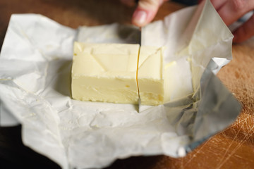 slicing butter brick with knife