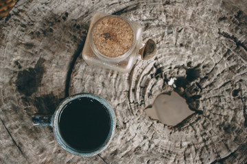 Coffee background, top view with copy space. Hot Coffee cup on the wooden table in cafe natural light, vintage tone hipster style concept.