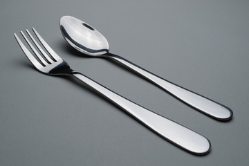 Cutlery on gray background.