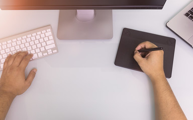 Close up hands male working on graphic tablet