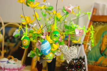 self made tree with blue yellow and green Easter eggs