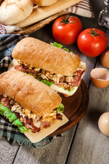Ciabatta sandwich with smoked bacon and eggs