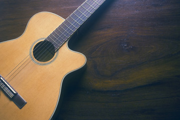 Fototapeta premium top view of music guitar on wood background