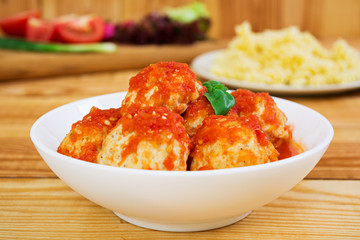Meatballs on wooden background