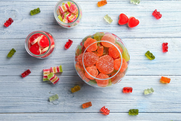 Composition with tasty candies on table