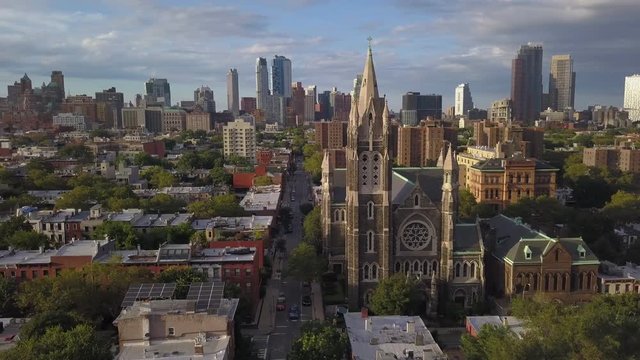 day wider orbiting counter clockwise around church spire in Gowanus Brooklyn