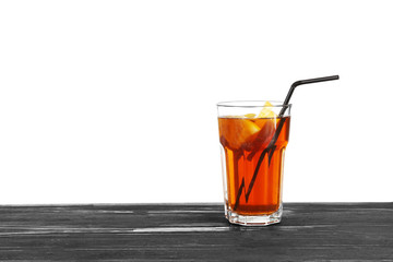 Glass of fresh black tea lemonade on white background