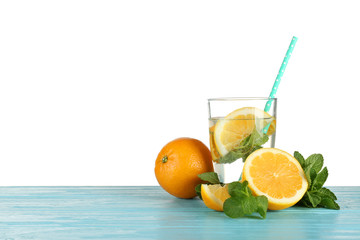 Glass of fresh citrus lemonade on white background