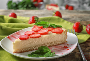 Piece of tasty strawberry cake on plate