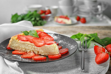 Piece of tasty strawberry cake on plate