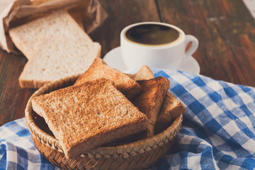 Breakfast background, toast and coffee on rustic wood