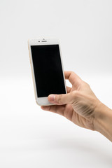 Female hand holding white cellphone with black screen