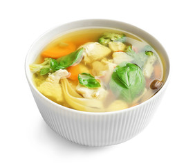 Bowl with delicious turkey soup on white background