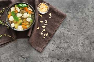 Bowl with delicious turkey soup on table