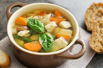 Casserole with delicious turkey soup on napkin