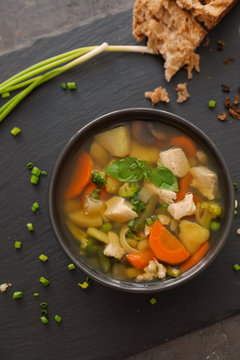 Bowl with delicious turkey soup on table