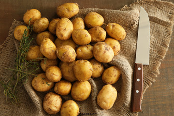 Raw organic potato on sackcloth