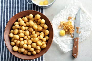 Composition with raw organic potato on table