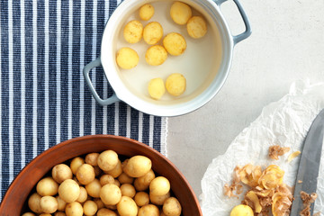 Composition with raw organic potato on table