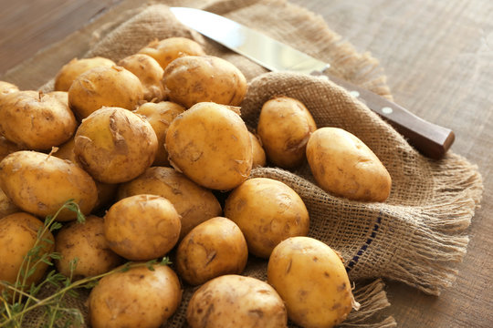 Raw organic potato on sackcloth