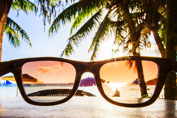 View on beach through sunglasses