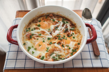 Shakshouka (Dish of eggs poached in a sauce of tomatoes)